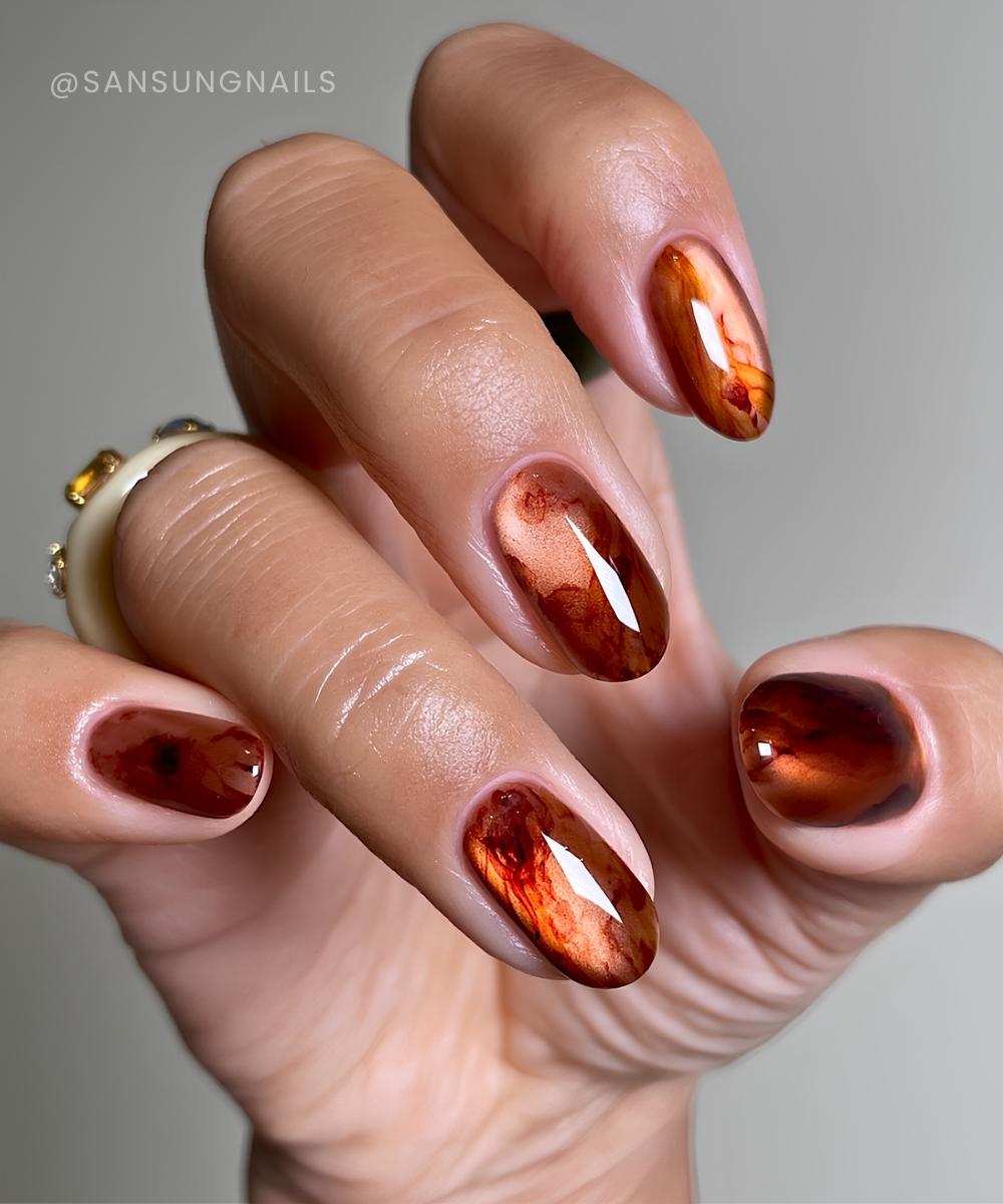 Bernstein Marmor Cat Eye Naegel