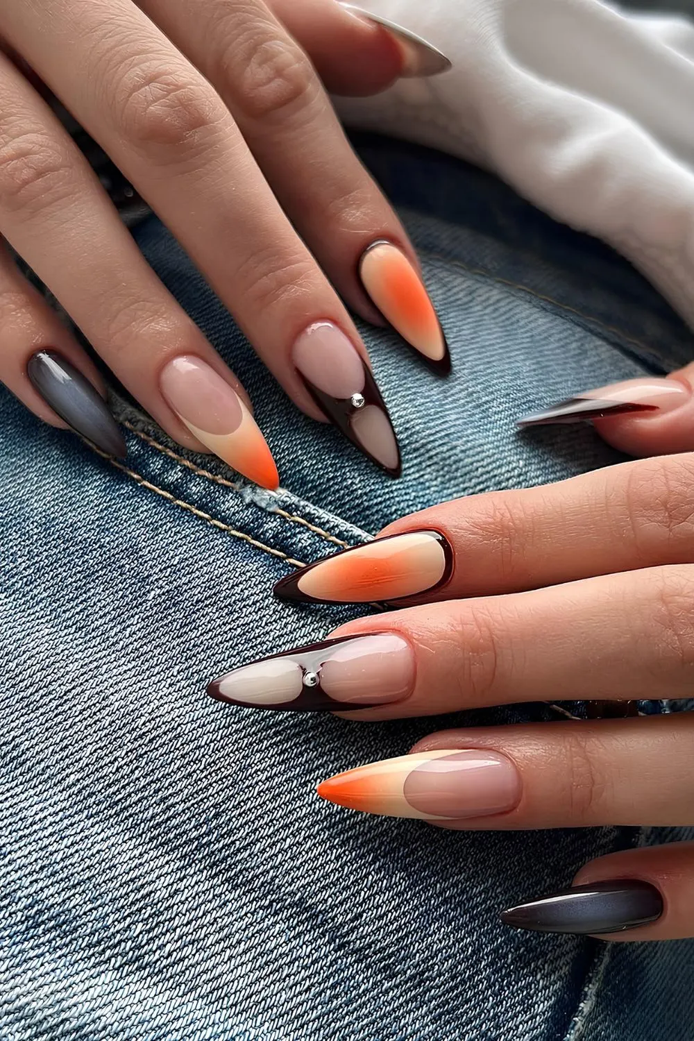 Orange-schwarze Mix-and-Match-Mani