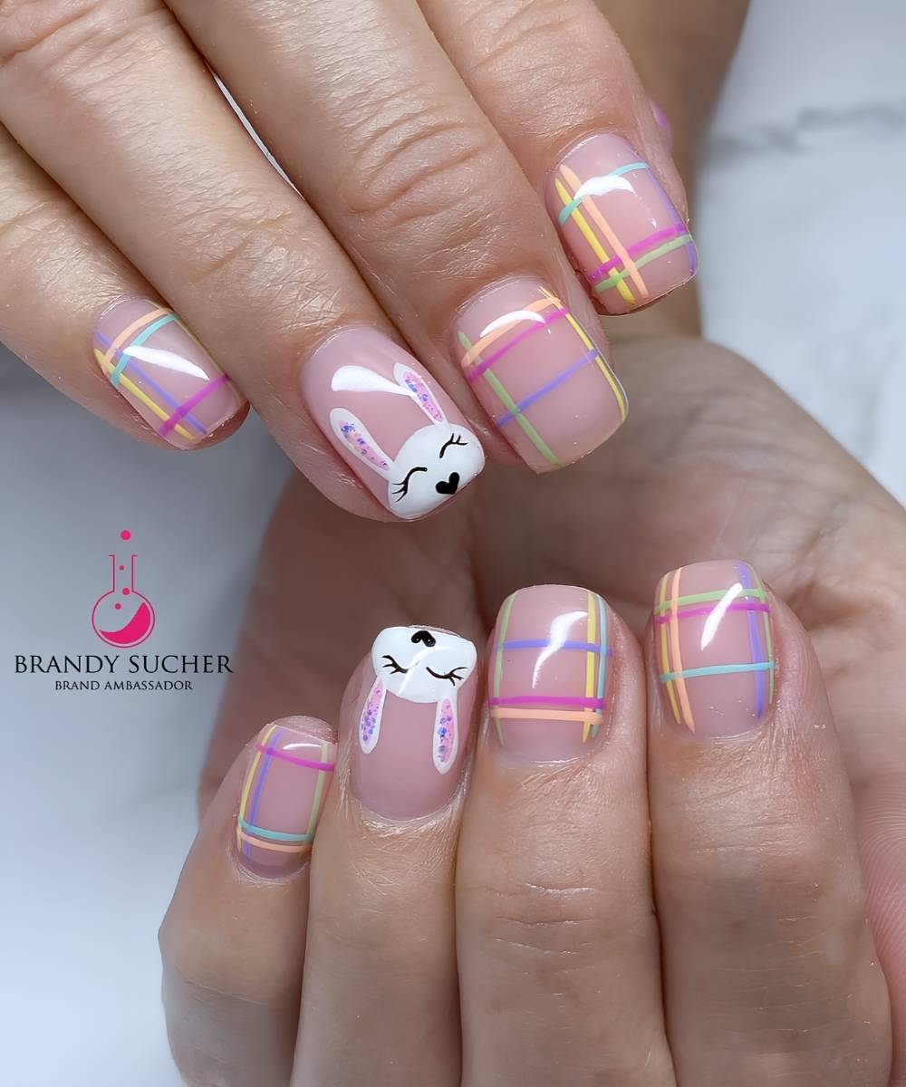 Short nails with colorful plaid and bunny art