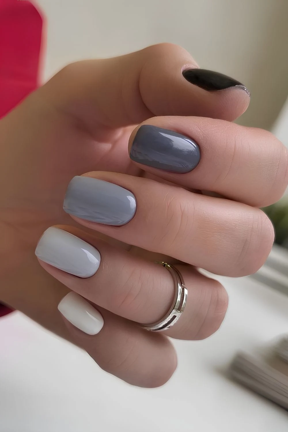 Skittle-Nägel in verschiedenen Grautönen