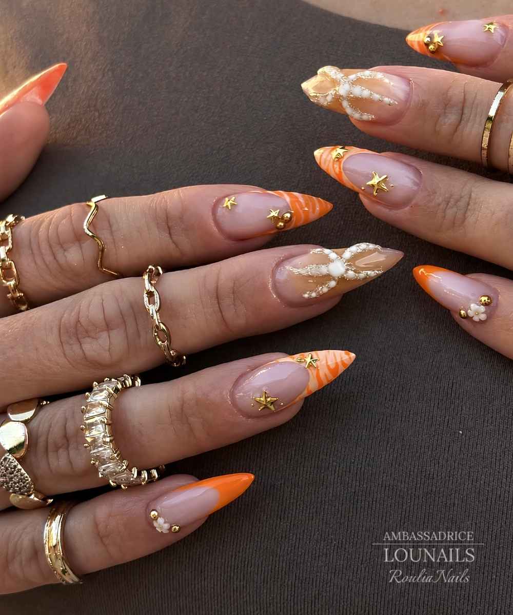 Orange Naegel mit Seestern Design