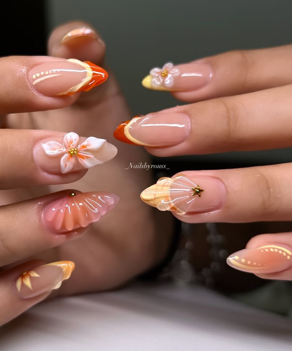 Orange gelbe Naegel mit 3D Blumen