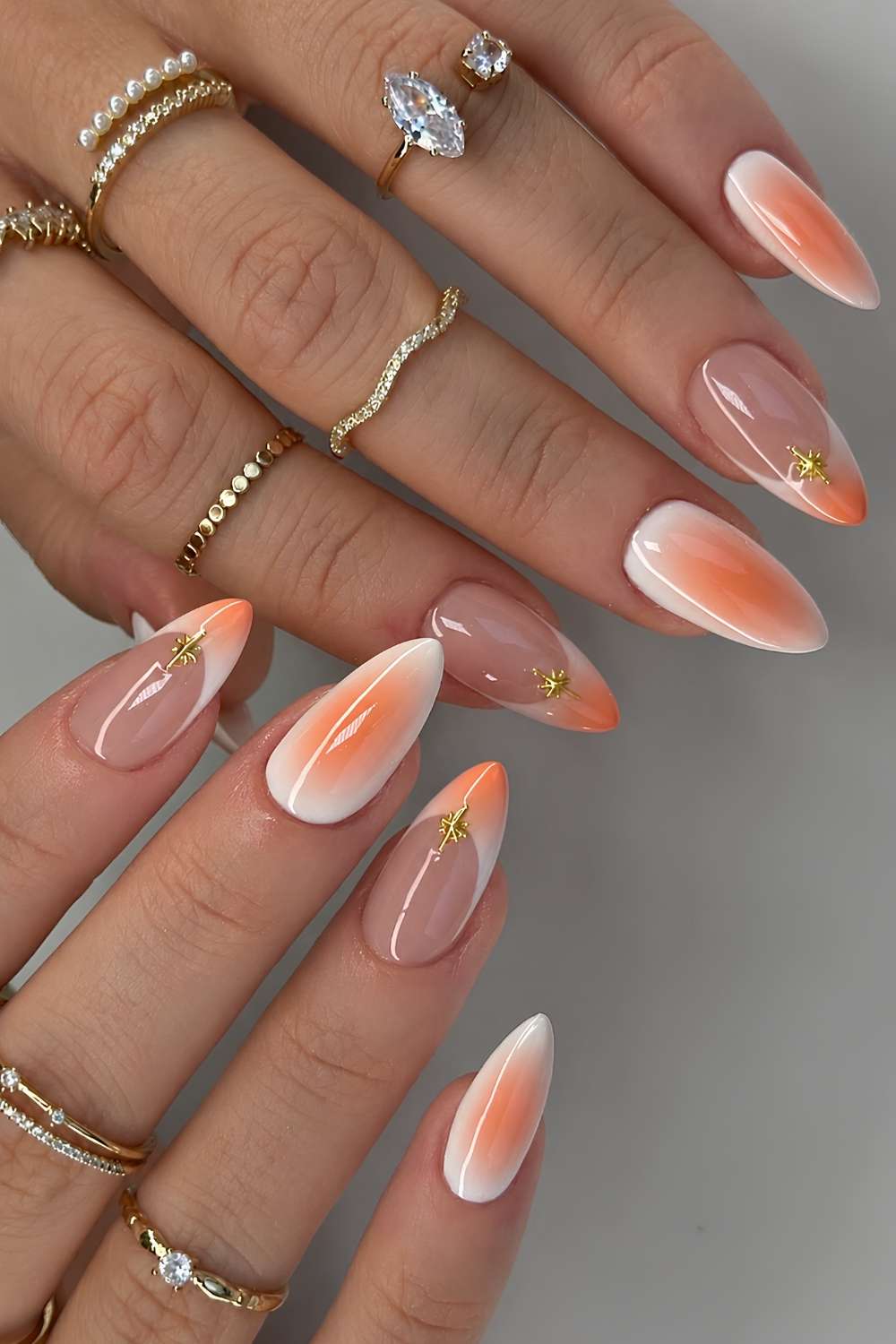 Weisse Naegel mit orange Aura Effekt