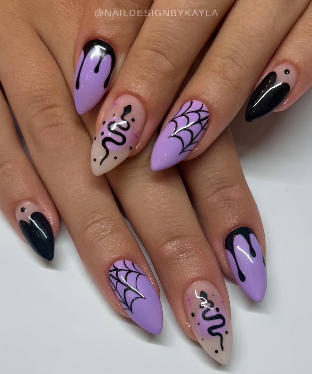 Schwarze und lila Halloween Naegel